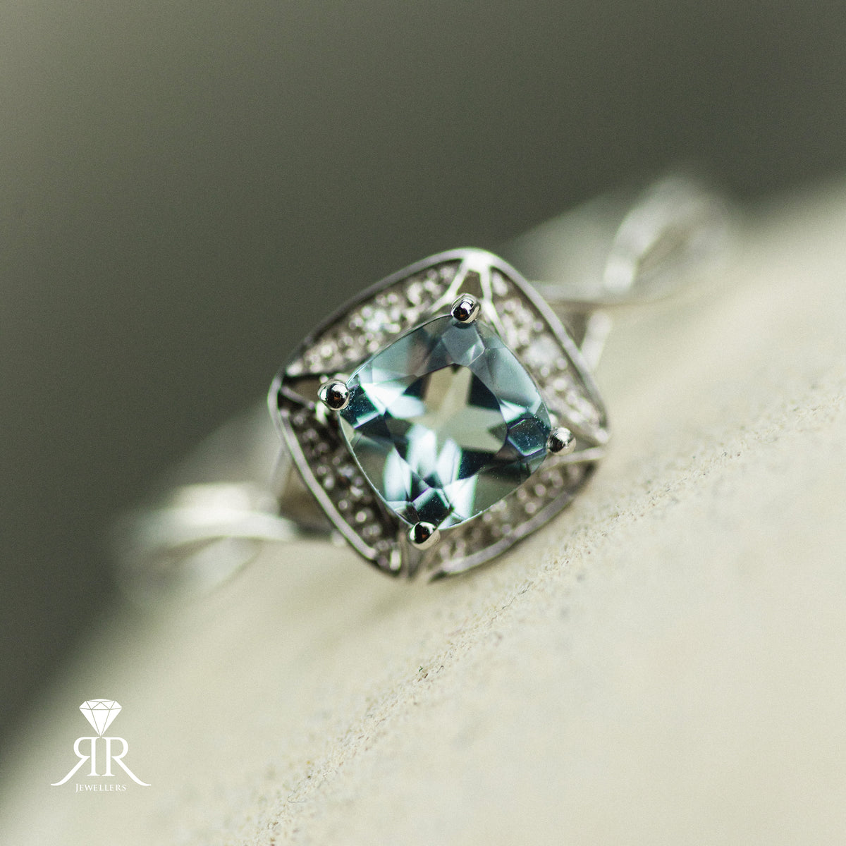 9ct white gold aquamarine and diamond twist halo ring