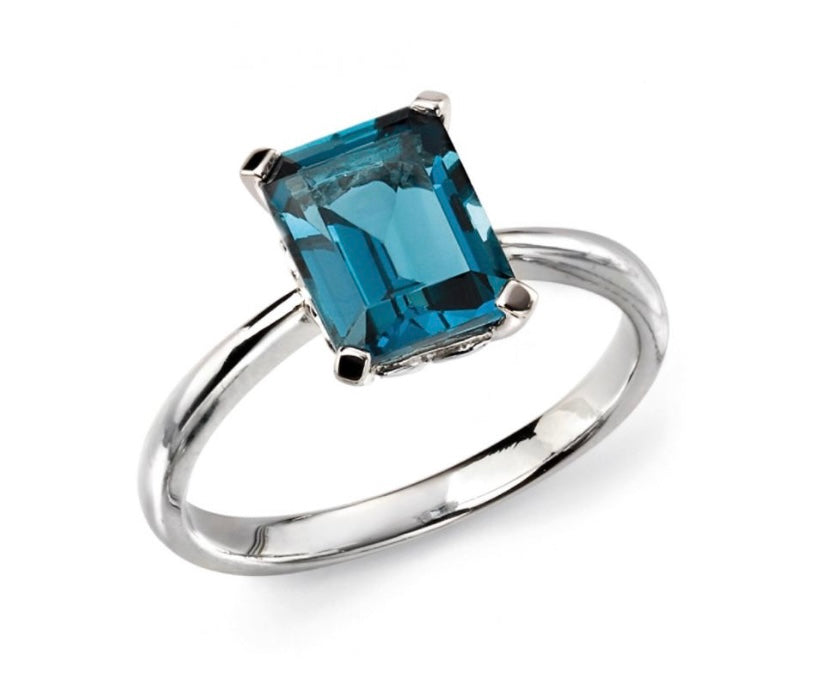 9ct white gold emerald cut london blue topaz 4 claw set ring