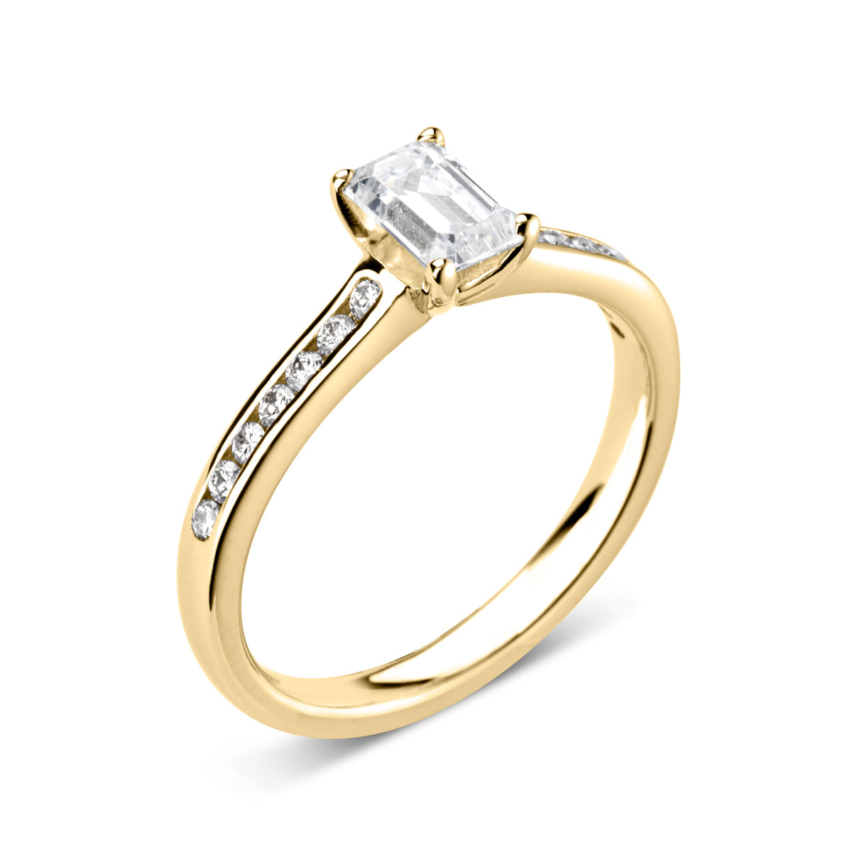 Emerald cut 4 claw diamond channel set ring
