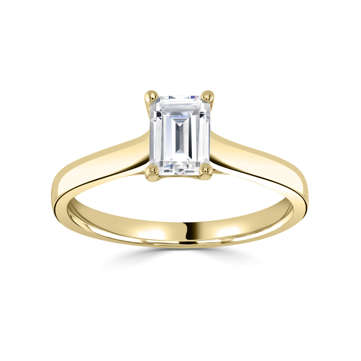 Emerald cut 4 claw diamond crossover ring